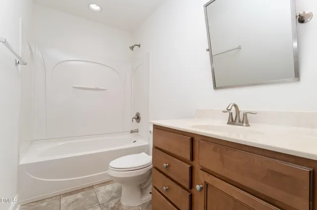 a bathroom with a sink a toilet and a bathtub