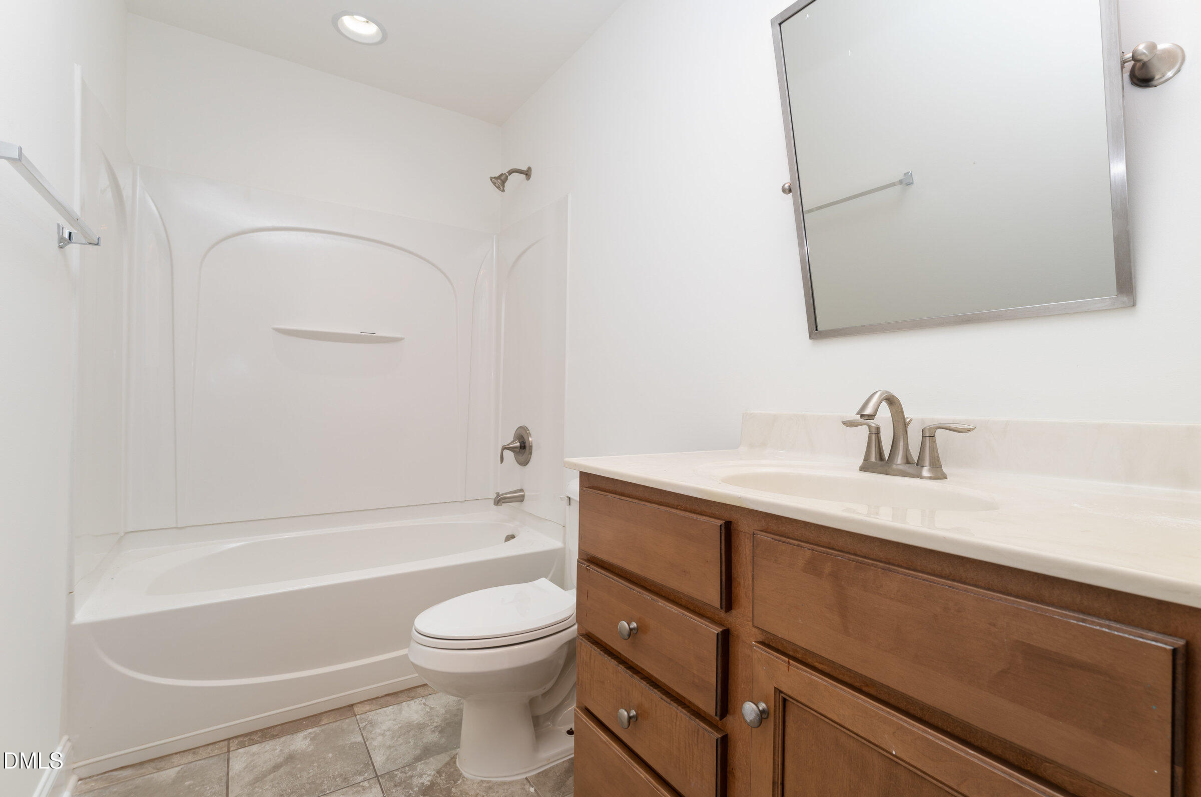 105 Leesville Loop Aberdeen, NC 28315 - Photo 26 of 32 a bathroom with a sink a toilet and a bathtub