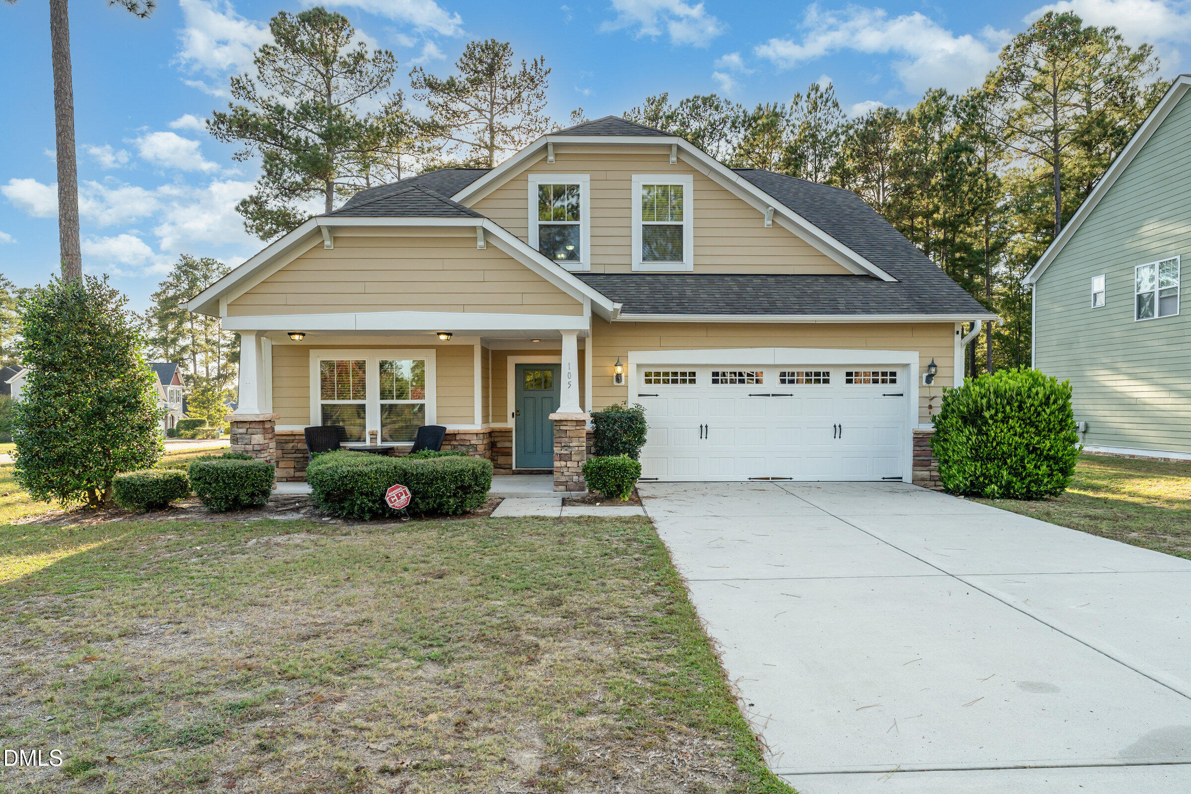 105 Leesville Loop Aberdeen, NC 28315 - Photo 2 of 32 a front view of a house with a yard and garage