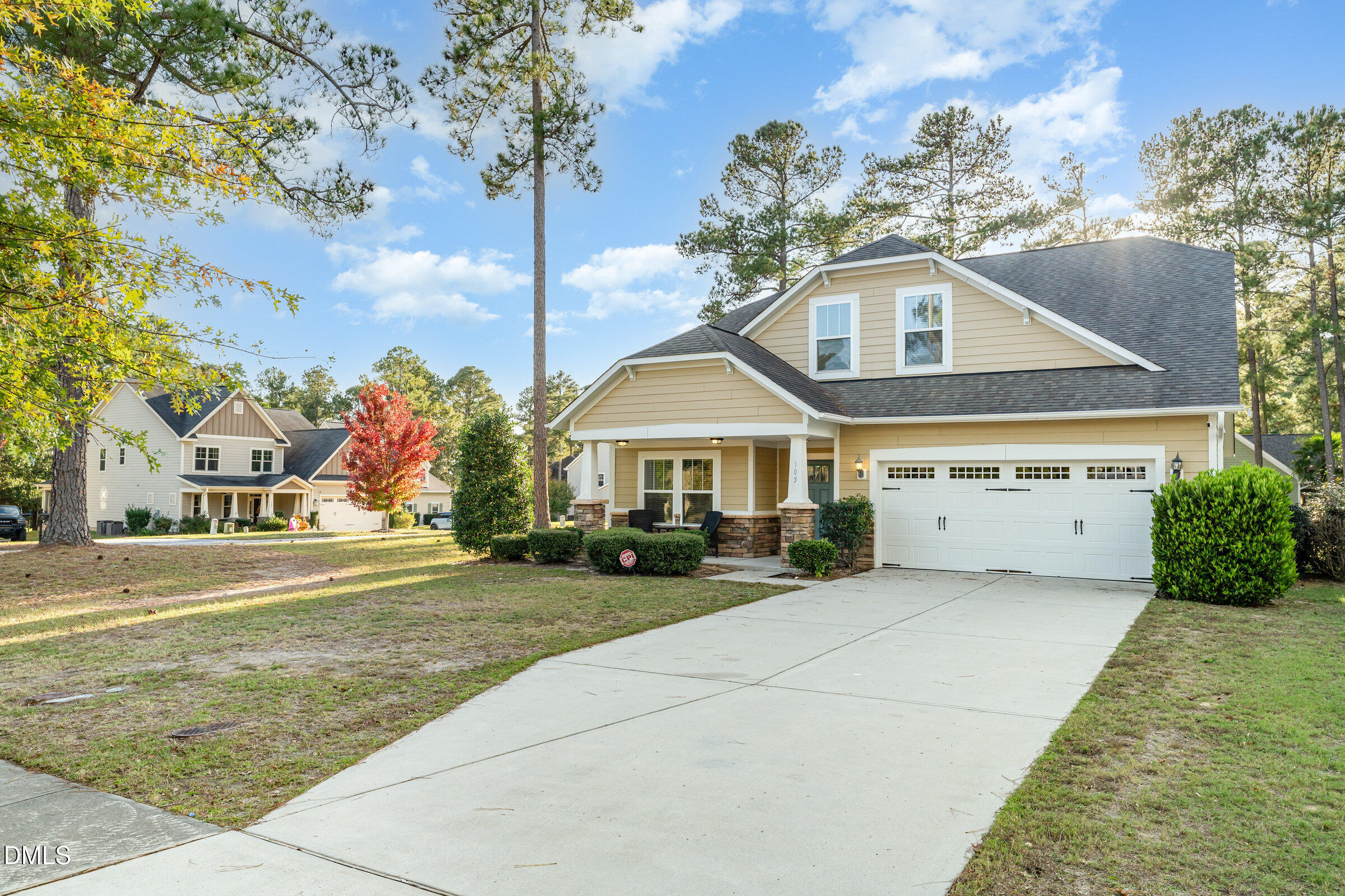 105 Leesville Loop Aberdeen, NC 28315 - Photo 3 of 32 a front view of a house with a garden