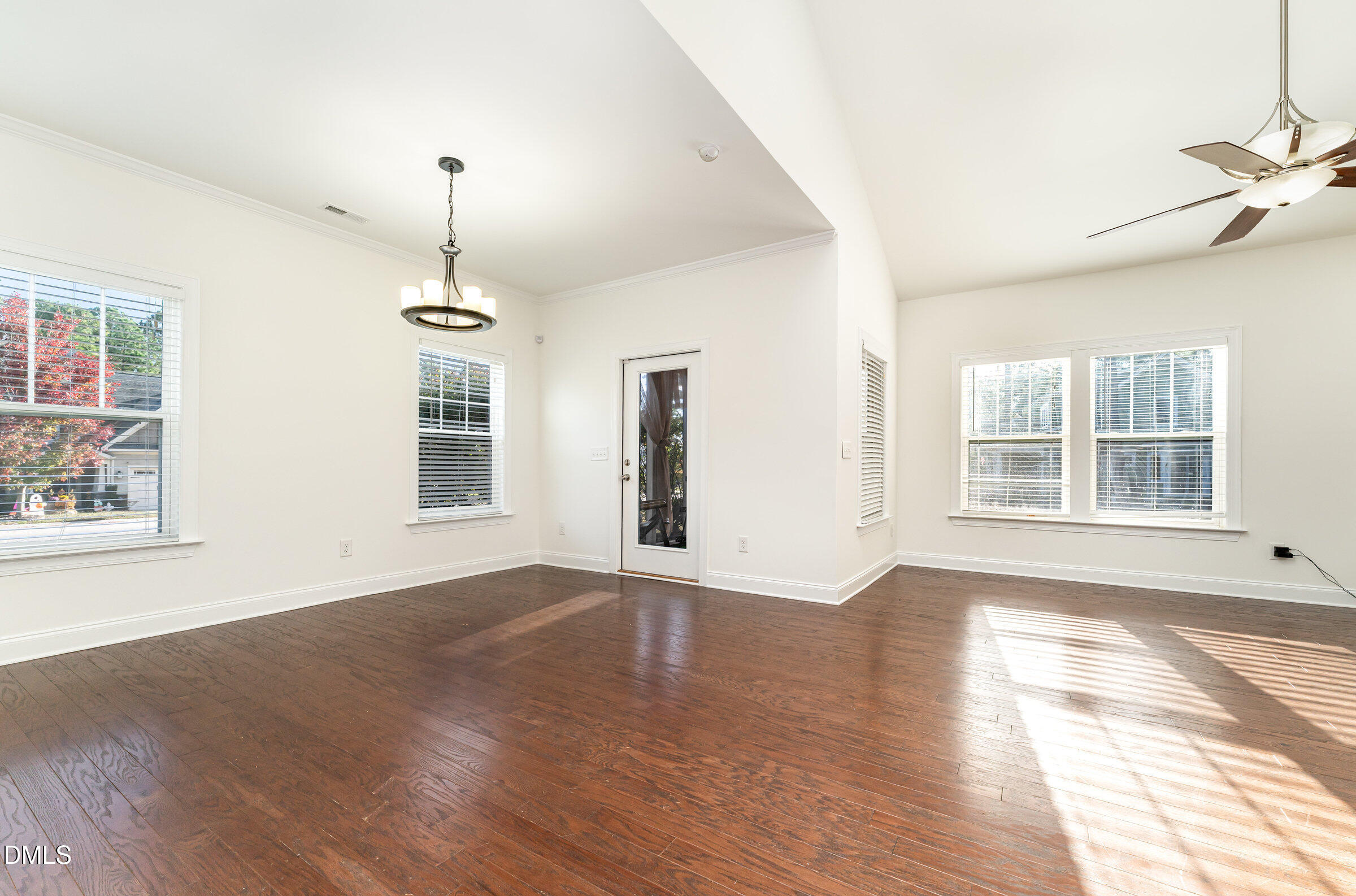 105 Leesville Loop Aberdeen, NC 28315 - Photo 6 of 32 a view of an empty room with window and wooden floor