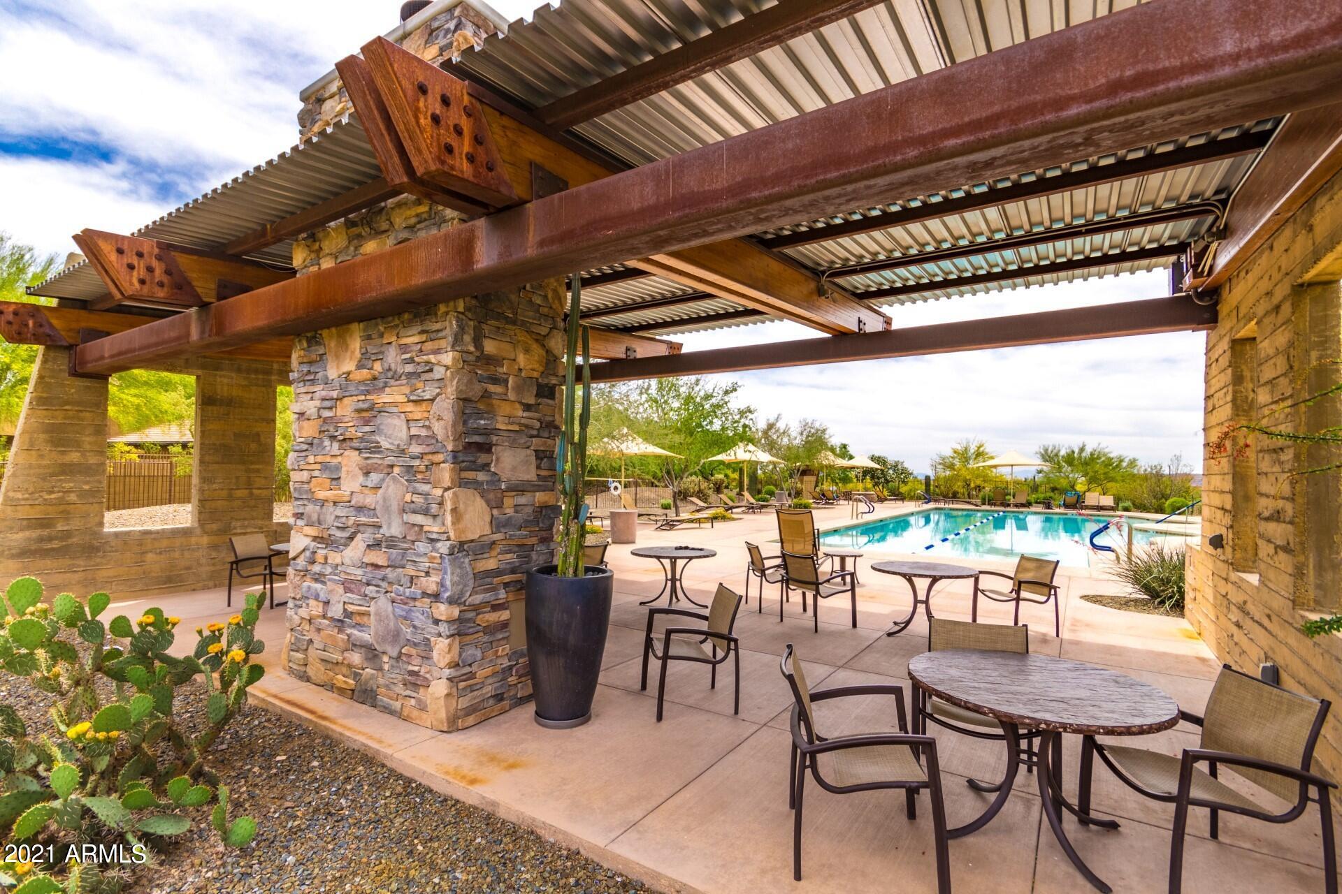 2005 West Steed Ridge Phoenix, AZ 85085 - Photo 59 of 66 a view of a patio with a table chairs and a backyard