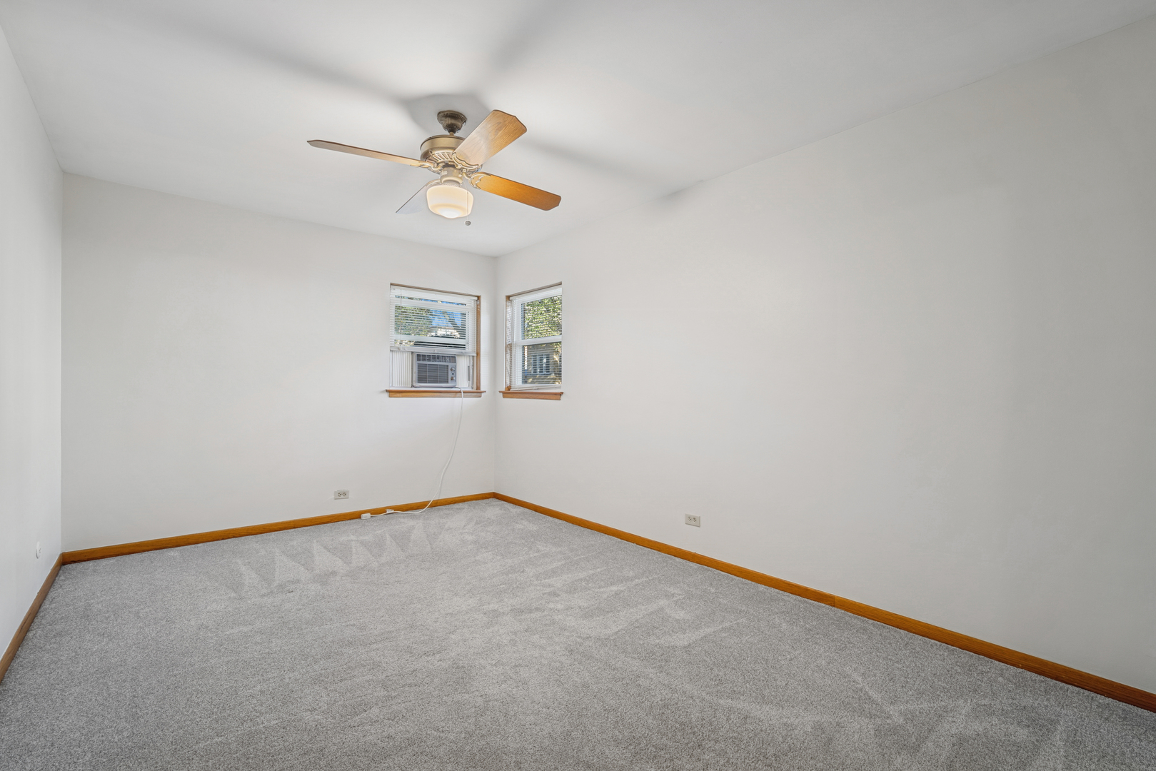 6800 North Overhill Avenue, Unit 1A Chicago, IL 60631 - Photo 10 of 20 an empty room with a window and a fan