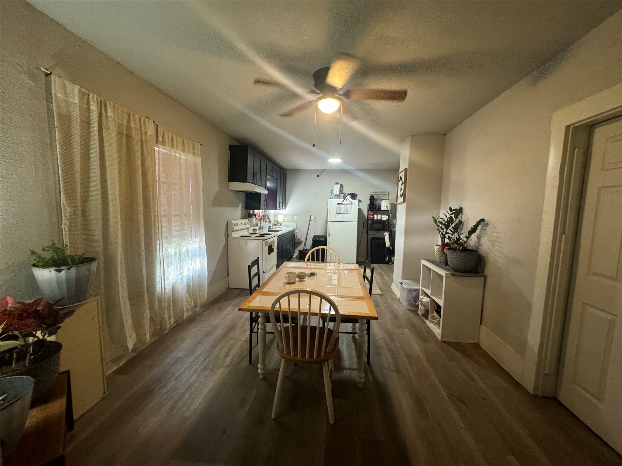 2515 Engelke Street Houston, TX 77003 - Photo 2 of 9 a view of a dining room with furniture window and wooden floor