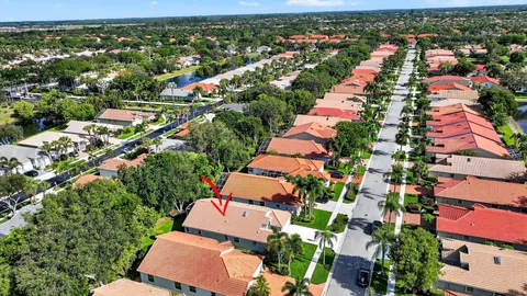 an aerial view of a house with a yard and garden