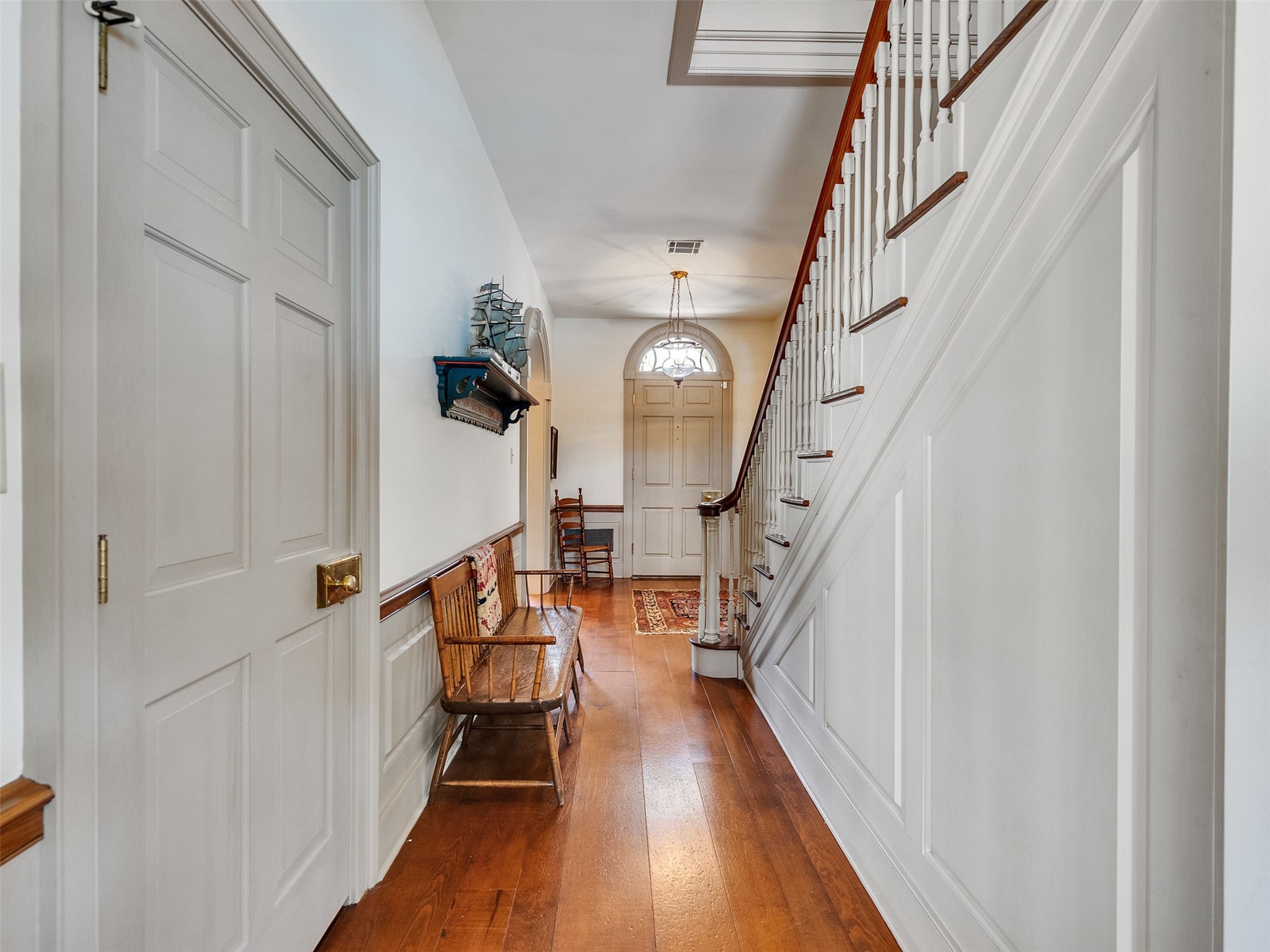 5212 Strack Road Houston, TX 77069 - Photo 42 of 42 Alternate view of entry where polished hardwoods lead through a series of wide openings, connecting the main living areas and highlighting a functional floor plan designed for effortless movement.