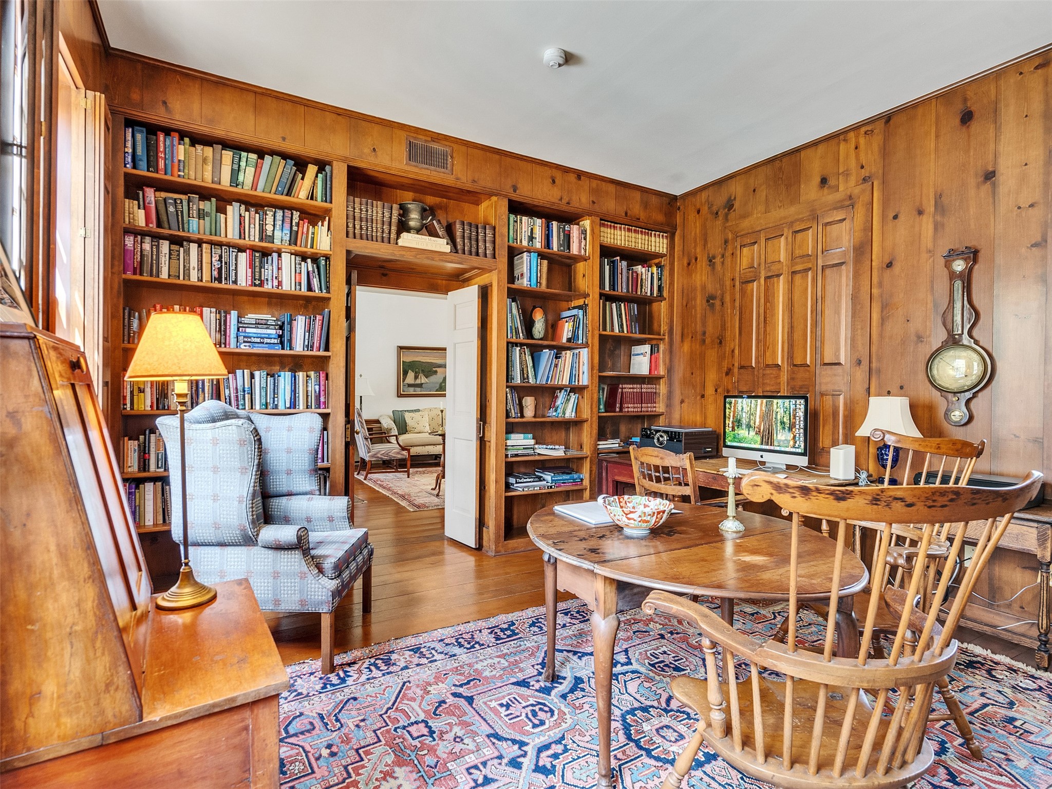 5212 Strack Road Houston, TX 77069 - Photo 8 of 42 Reminiscent of a historic manor, the library features stunning artisanal woodwork, integrated shelving, and classic molding.This masterful space offers a rare sense of history, providing a sanctuary for the avid reader or professional.