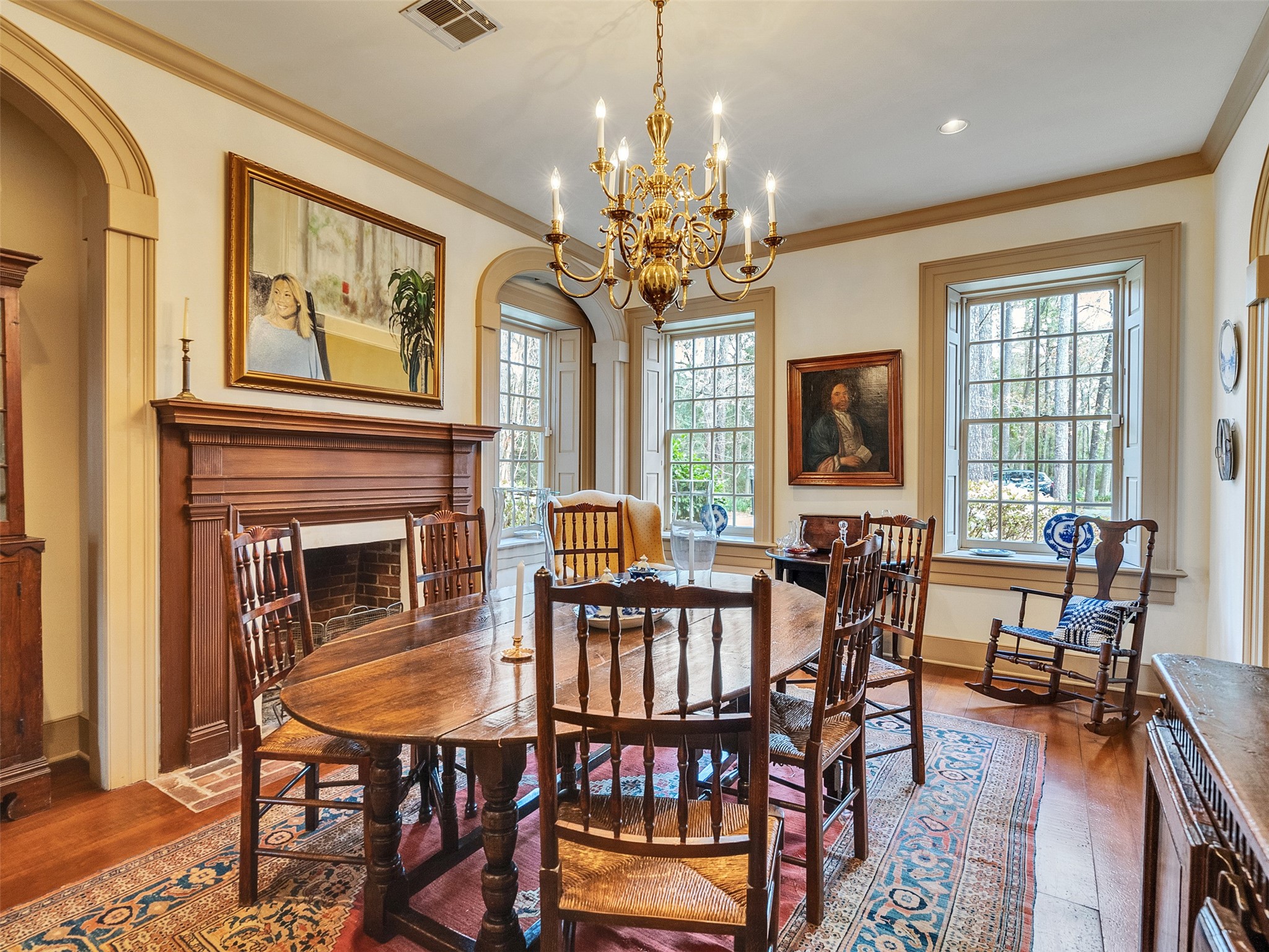 5212 Strack Road Houston, TX 77069 - Photo 9 of 42 The formal dining room is bathed in natural light from large windows equipped with custom interior shutters and features another stunning fireplace