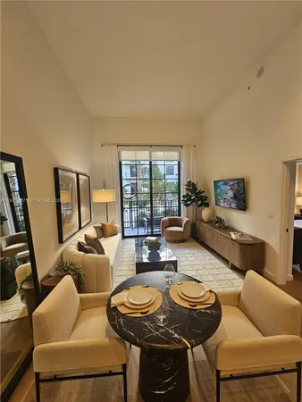 a large kitchen with a table and chairs in it