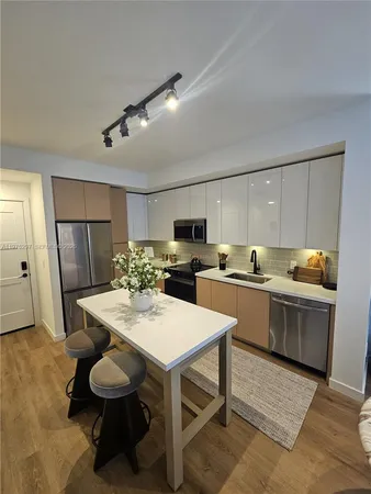 a bedroom with a bed and a mirror