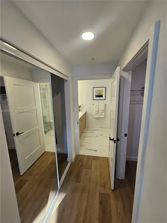 a spacious bathroom with a granite countertop sink a toilet and shower