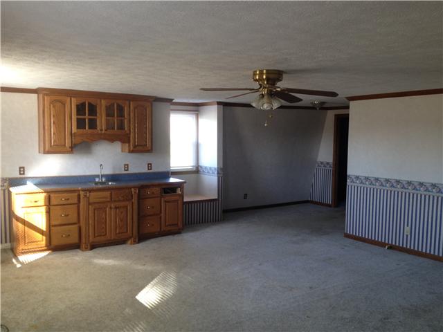 365 Academy Road Lebanon, TN 37087 - Photo 6 of 9 a kitchen with stainless steel appliances granite countertop a stove a sink and a refrigerator