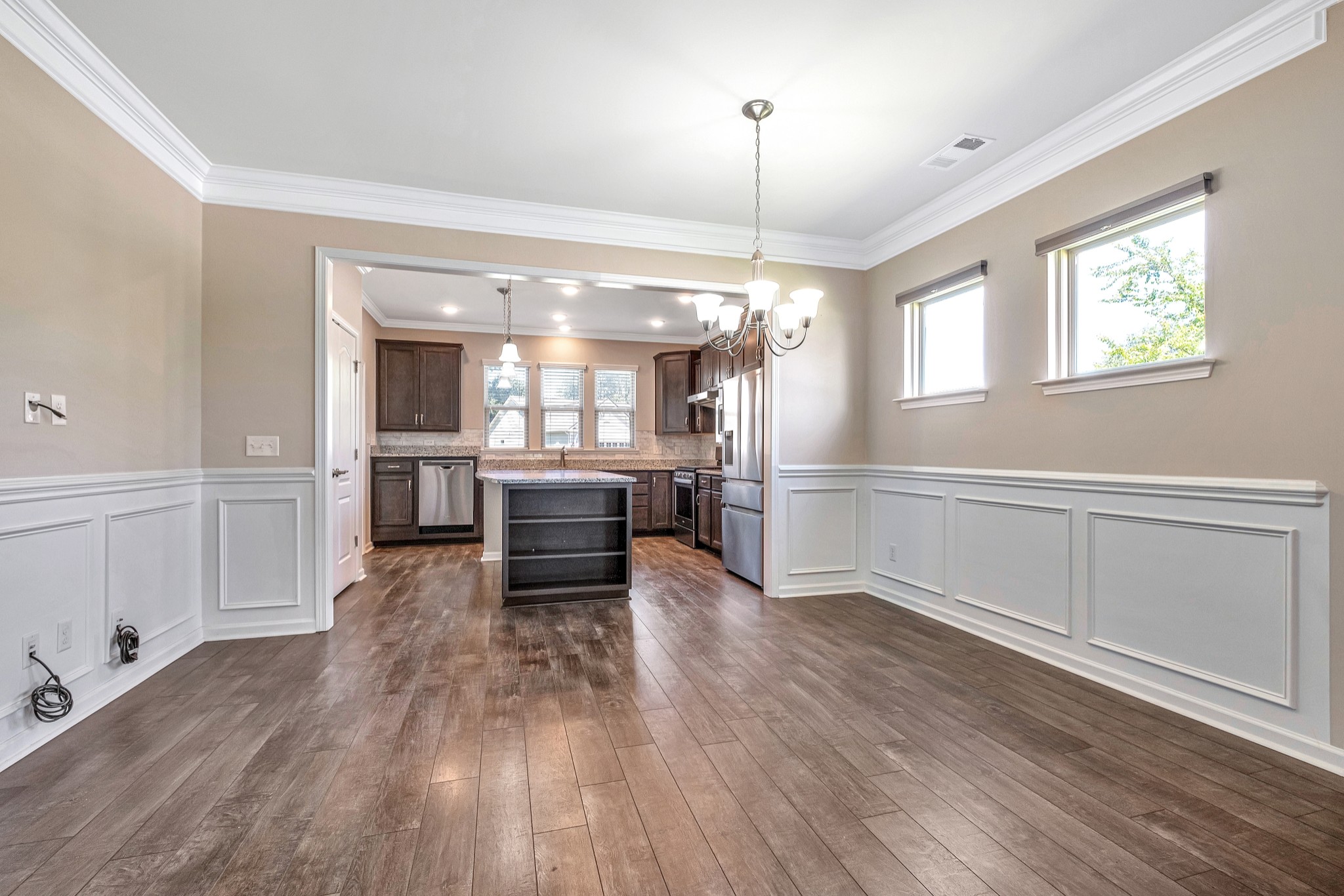 104 Tipton Pass Spring Hill, TN 37174 - Photo 14 of 57 a view of a kitchen center island wooden floor and electronic appliances