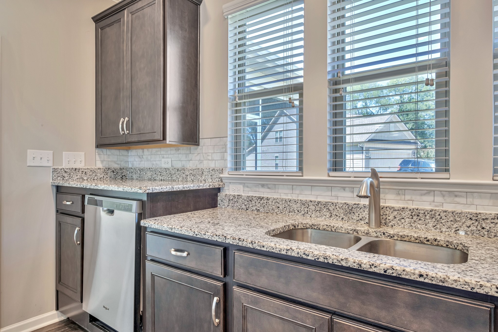 104 Tipton Pass Spring Hill, TN 37174 - Photo 18 of 57 a kitchen with granite countertop a sink and a window