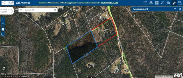 a view of walk in closet with clothes