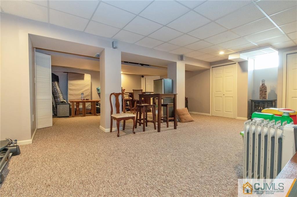 15 Crescent Road Old Bridge, NJ 08857 - Photo 14 of 19 a living room with furniture and a dining table