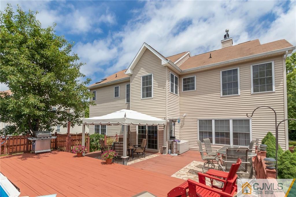 15 Crescent Road Old Bridge, NJ 08857 - Photo 15 of 19 a backyard of a house with table and chairs