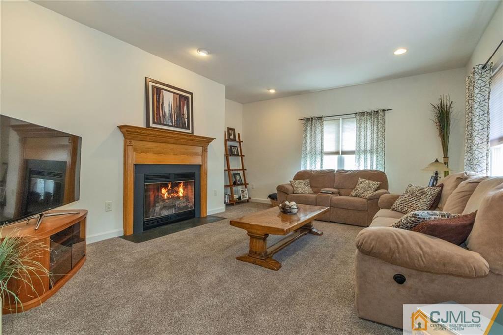 15 Crescent Road Old Bridge, NJ 08857 - Photo 3 of 19 a living room with furniture and a fireplace