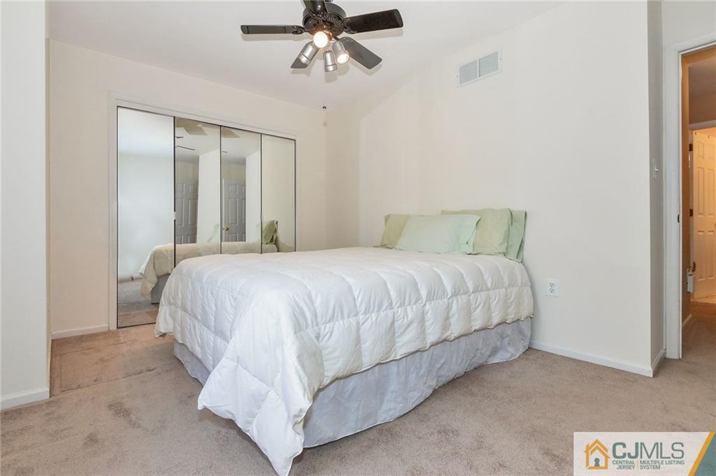 15 Crescent Road Old Bridge, NJ 08857 - Photo 10 of 19 a bedroom with a bed and painting on the wall