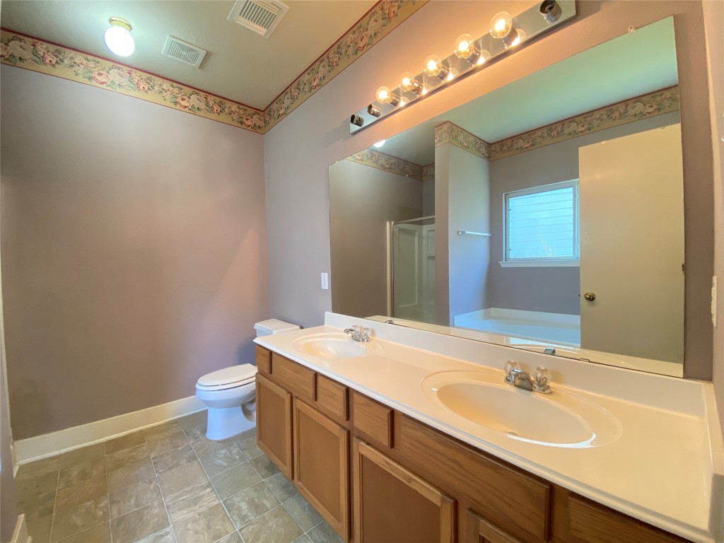 5843 Sonoma Ridge Missouri City, TX 77459 - Photo 13 of 20 a bathroom with a sink and a mirror