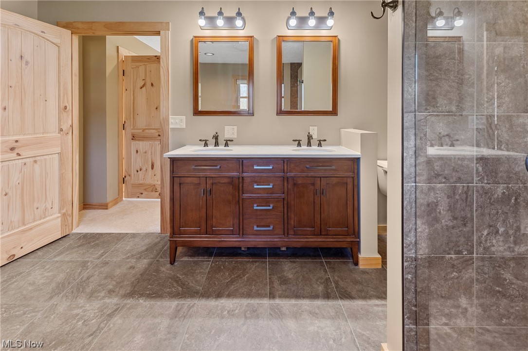 485 Dry Ridge Road Cameron, WV 26033 - Photo 19 of 35 Bathroom featuring dual vanity, tile flooring, and a tile shower