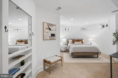 a bedroom with furniture and a bathroom