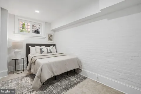 a bedroom with a bed and night stand