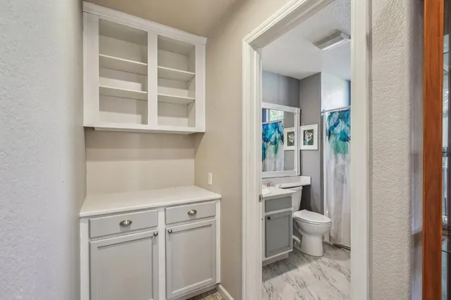 a view of bathroom with a toilet sink and a window