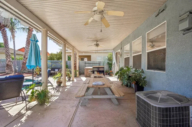 a view of a house with swimming pool patio and swimming pool
