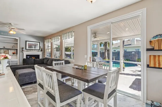 a view of a dining room with furniture window and outside view