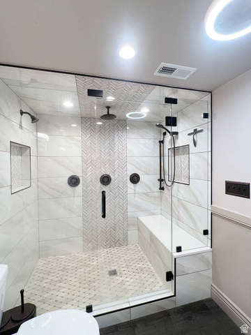 3138 Jean Street Magna, UT 84044 - Photo 18 of 26 Expansive shower enclosure featuring clear glass panels and matte black fixtures