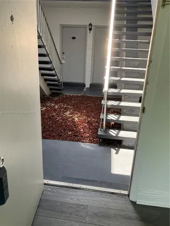 a view of entryway with wooden floor