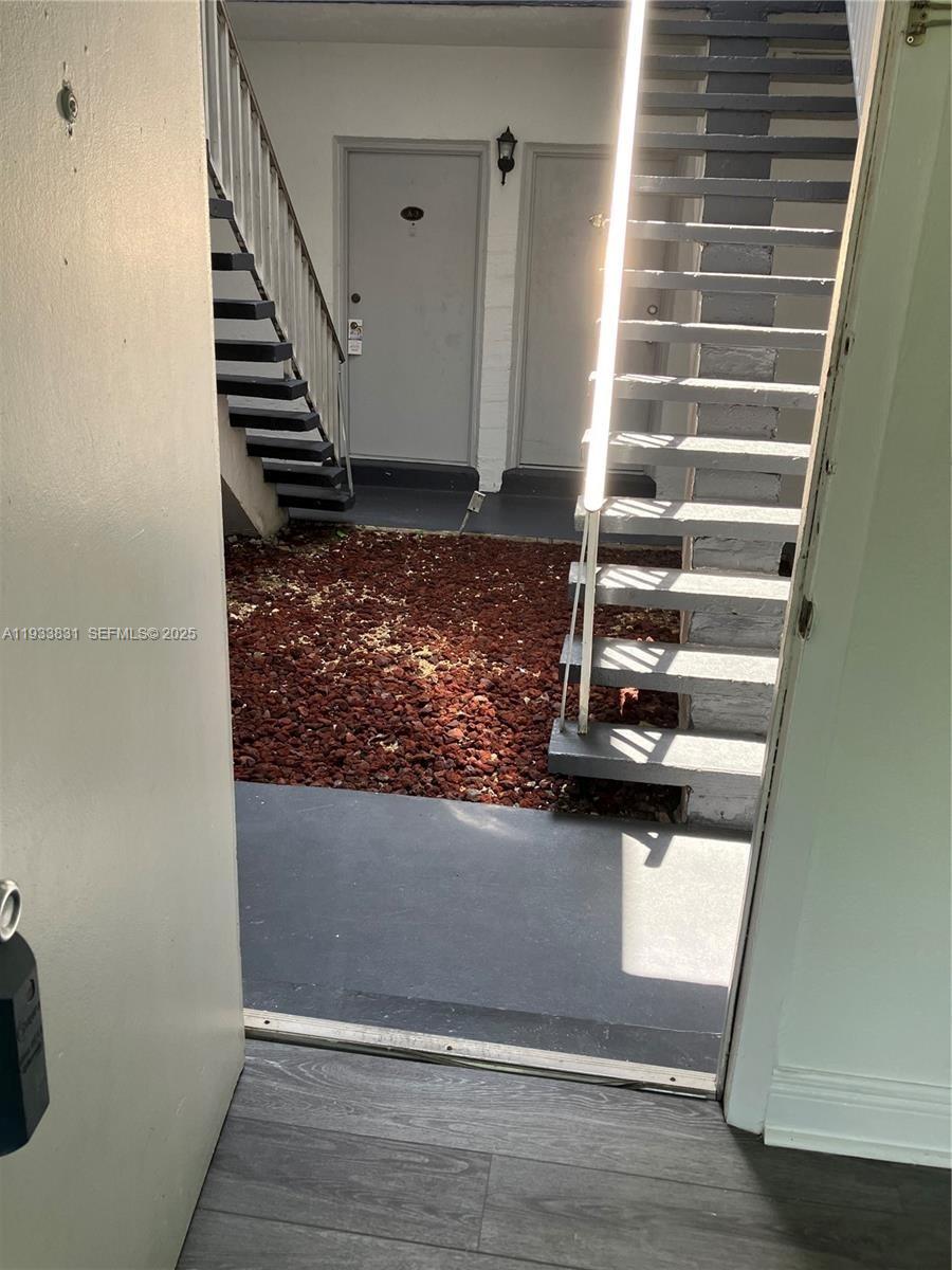 7256 Southwest 94th Place, Unit A1 Miami, FL 33173 - Photo 6 of 7 a view of entryway with wooden floor