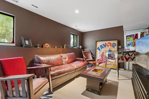 a living room with furniture a couch and a window