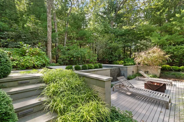 a view of a balcony with two chairs and a table