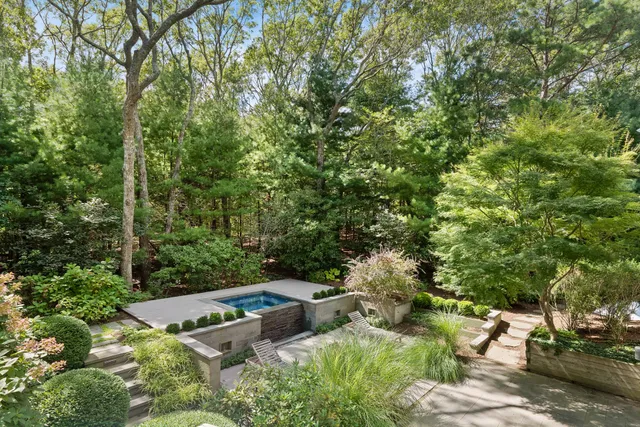 a view of a house with yard and outdoor seating