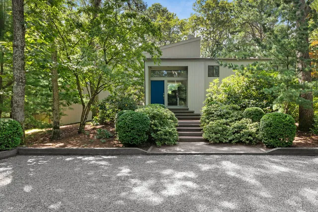 a view of a house with a tree