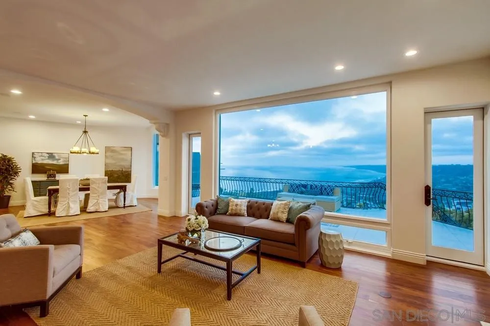 7411 Hillside Drive La Jolla, CA 92037 - Photo 1 of 25 a living room with furniture and a large window