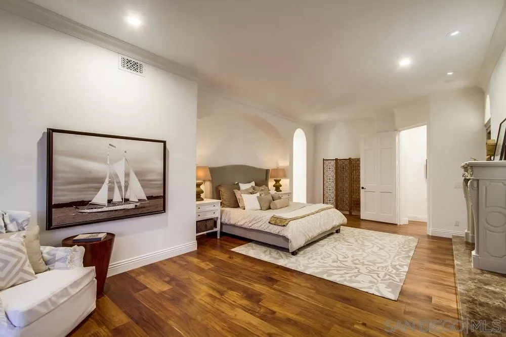 7411 Hillside Drive La Jolla, CA 92037 - Photo 16 of 25 a bedroom with furniture and a large mirror