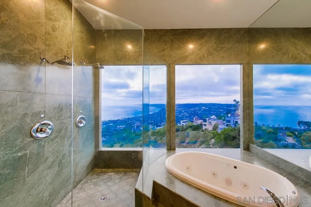 7411 Hillside Drive La Jolla, CA 92037 - Photo 20 of 25 a bathroom with a bathtub and shower