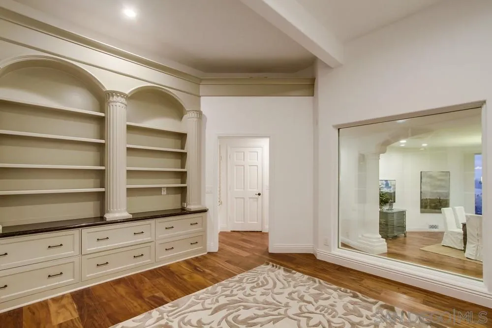 7411 Hillside Drive La Jolla, CA 92037 - Photo 22 of 25 a view of room with window and wooden floor