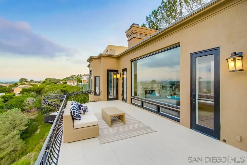 7411 Hillside Drive La Jolla, CA 92037 - Photo 23 of 25 a balcony with furniture and a potted plant