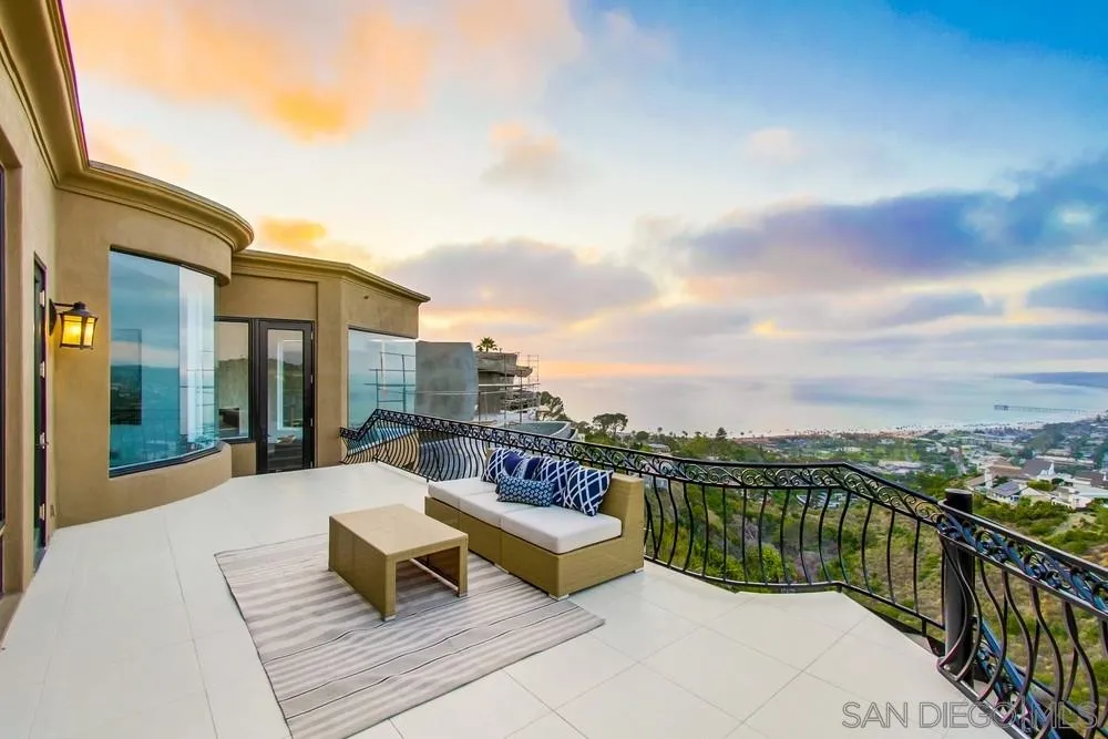 7411 Hillside Drive La Jolla, CA 92037 - Photo 24 of 25 a roof deck with outdoor seating and city view