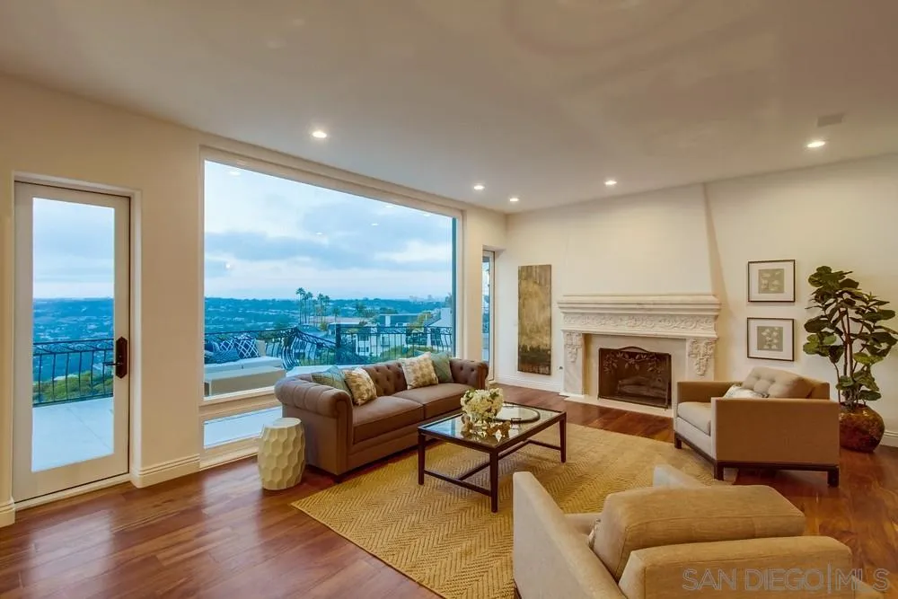 7411 Hillside Drive La Jolla, CA 92037 - Photo 6 of 25 a living room with furniture and a fireplace