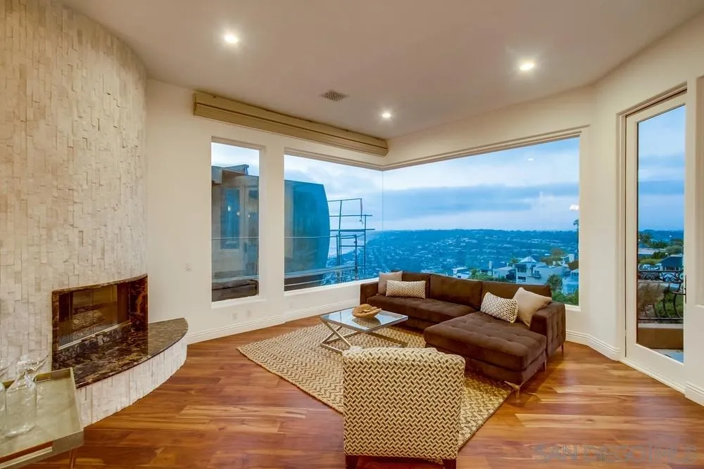 7411 Hillside Drive La Jolla, CA 92037 - Photo 8 of 25 a living room with furniture and a fireplace