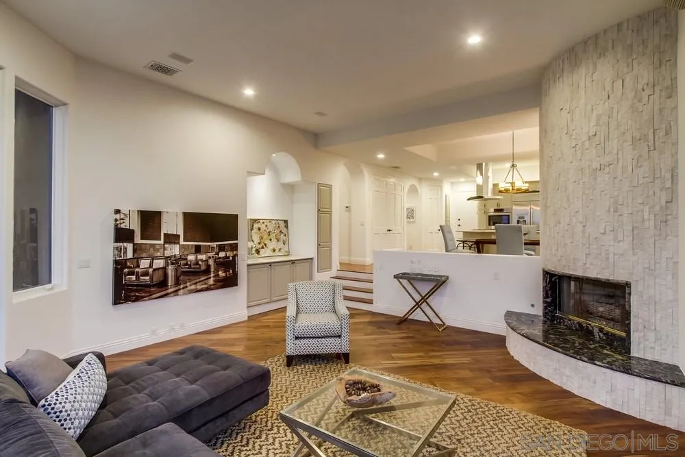 7411 Hillside Drive La Jolla, CA 92037 - Photo 10 of 25 a living room with furniture and a flat screen tv