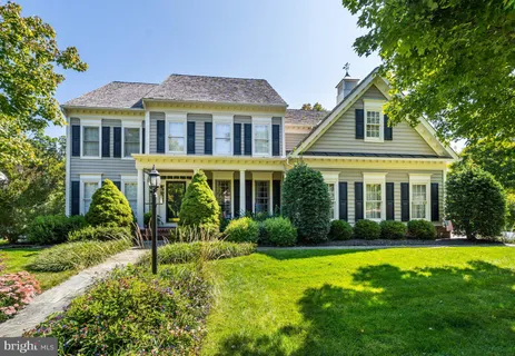a view of staircase with wooden floor and a rug