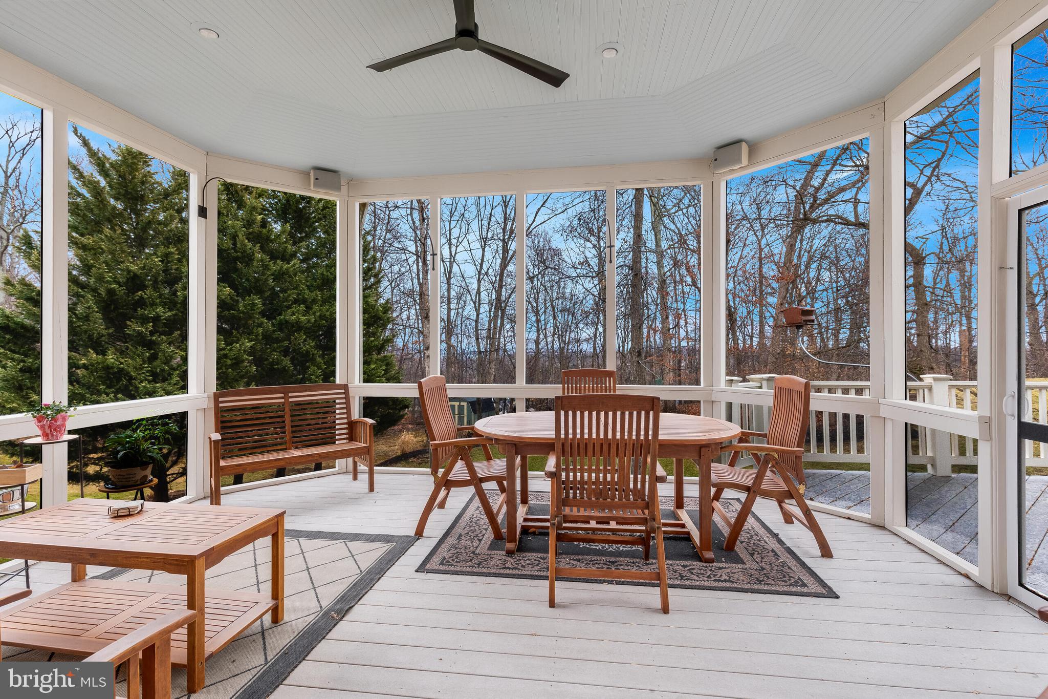 1181 Hawling Place Southwest Leesburg, VA 20175 - Photo 22 of 66 a view of a dining room with furniture large windows and wooden floor
