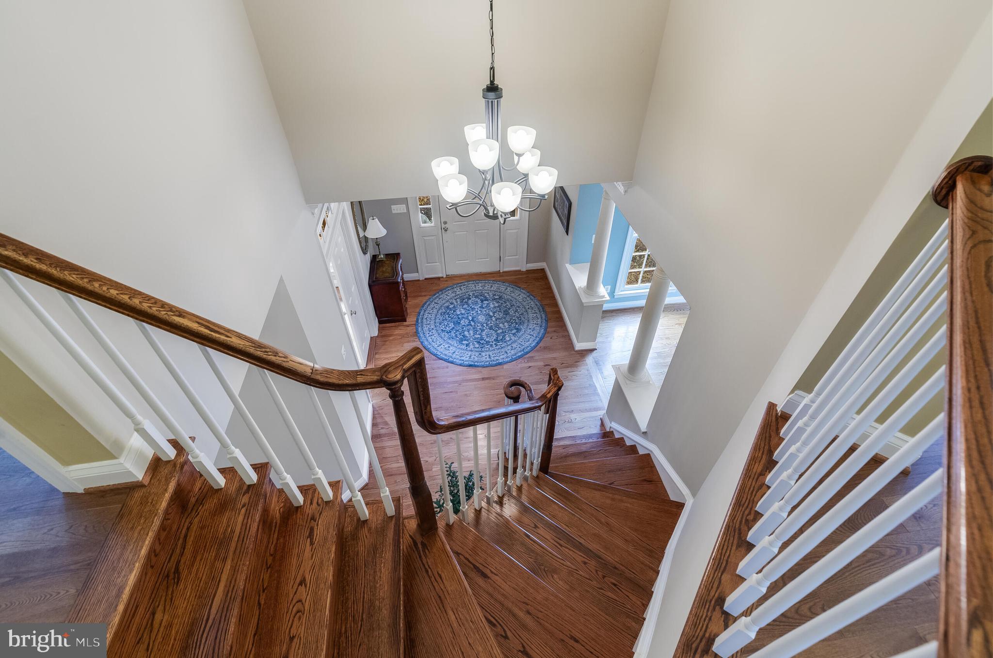 1181 Hawling Place Southwest Leesburg, VA 20175 - Photo 26 of 66 a view of a dining room with furniture wooden floor and chandelier