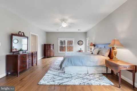 a bathroom with a granite countertop bathtub and shower